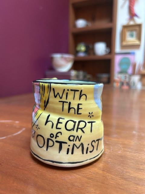 original mug WITH THE HEART OF AN OPTIMIST